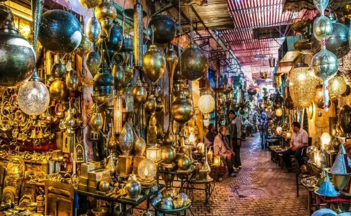 Half day City Tour : Craftsmen at work in the bustling Metal Souk Addadine, amidst a variety of traditional metal creations, in the heart of Medina Marrakech