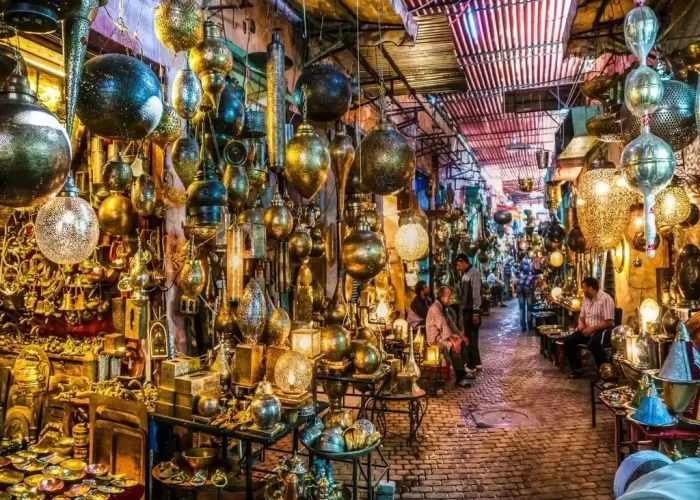 Half day City Tour : Craftsmen at work in the bustling Metal Souk Addadine, amidst a variety of traditional metal creations, in the heart of Medina Marrakech