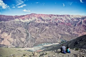 Experience the Thrill: Trekking Adventure in Mountain Maroc 1 Group of hikers planning their trekking route in the scenic Montagne Maroc, using a map and gear.