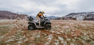  A rider reflecting on their quad biking adventure in the Moroccan landscape.