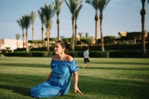 Marrakech Magic: 10 Must Fun Activities to do in Marrakech 2 Tranquil scene of a person relaxing in the lush Marrakech gardens, surrounded by vibrant flowers and greenery.