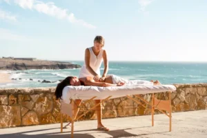 A serene setting featuring a traditional Moroccan massage, with candles, oils, and a relaxing atmosphere.